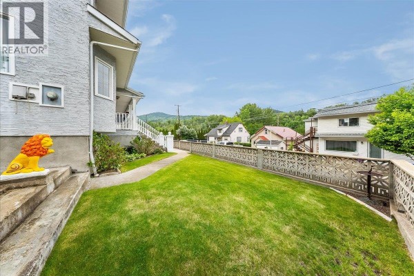 Basement suite with a kitchenette, bed, treadmill, and mini-fridge. - 128 Colley Street, Warfield