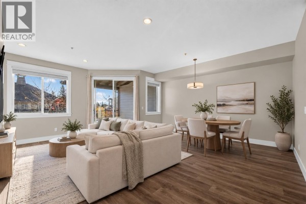 Aerial view of multiple grey townhouses with balconies and pitched roofs. - 12840 Stillwater Court Unit# 11, Lake Country