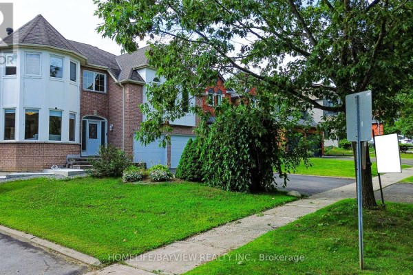 Wide, bright entryway with tiled floors, a winding staircase, and doorways leading to other rooms. - 129 Mcclellan Way, Aurora