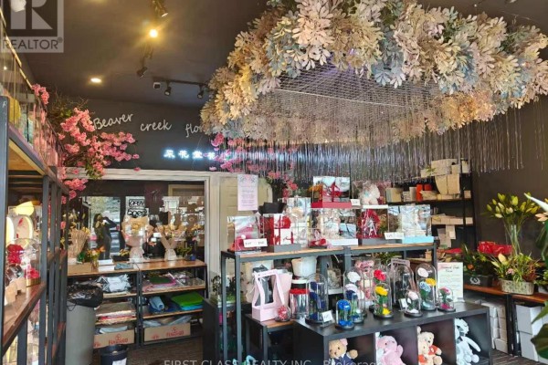 Interior view of a florist shop with flower displays, shelving, and decorative ceiling installation. - 13 - 50 Lockridge Avenue, Markham