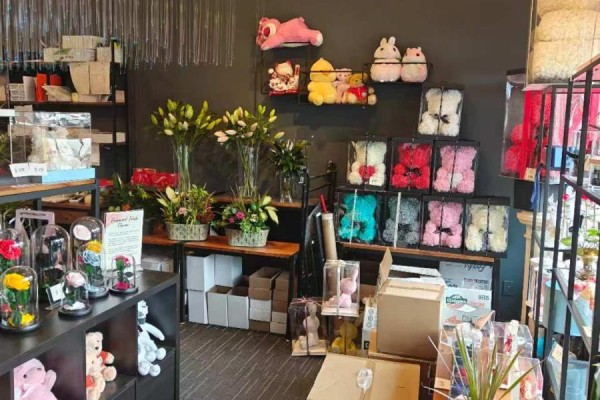 A wall display of colorful teddy bear flower arrangements and lilies in glass vases. - 13 - 50 Lockridge Avenue, Markham