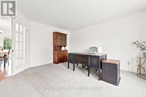 Office with desk, chair, cabinet, and french doors - 13 Springfield Drive Whitewater Region