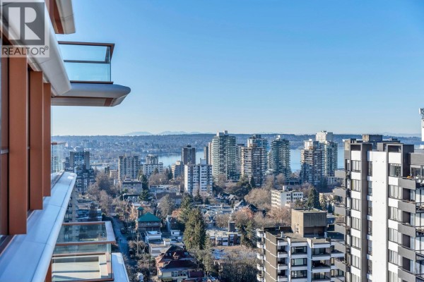 Empty bedroom with a single window showcasing city views and hardwood flooring - 1303 1408 Robson Street, Vancouver