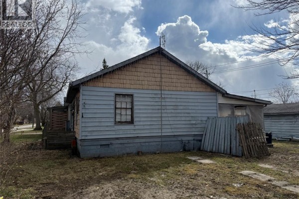 House exterior with wood siding and shingle gable - 1303 Central Windsor
