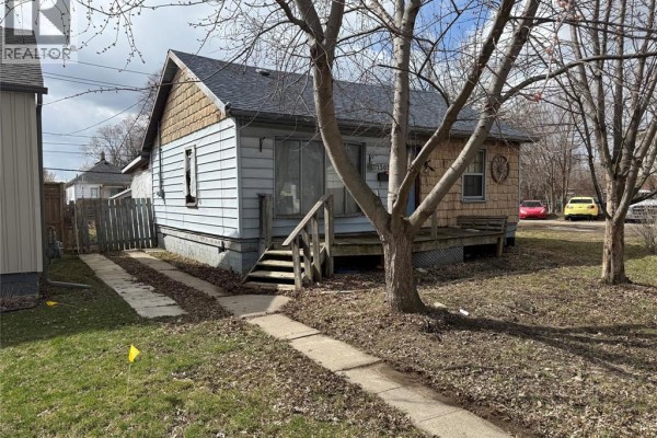 House with blue siding and wooden deck - 1503 Central Windsor