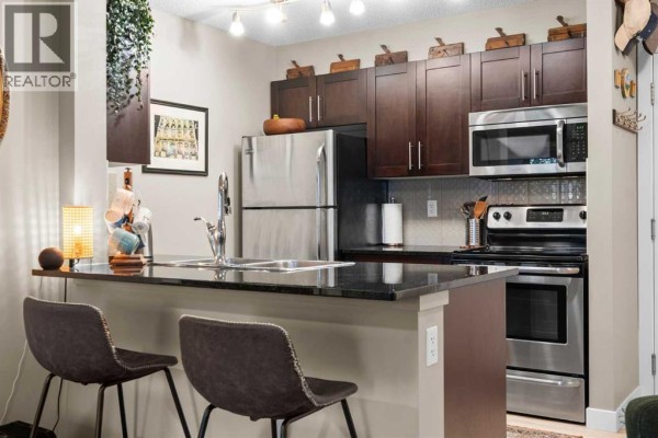 Living room - 1304, 81 Legacy Boulevard Se, Calgary, AB T2X2B9 Photo 4