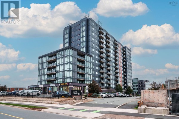 Exterior view of a modern, multi-story apartment building with balconies and large windows. - 1305 3471 Dutch Village Road, Halifax