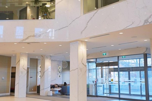 Lobby area featuring marble walls, modern lighting, and glass partitions - 1306 - 50 Ann O'reilly Road, Toronto