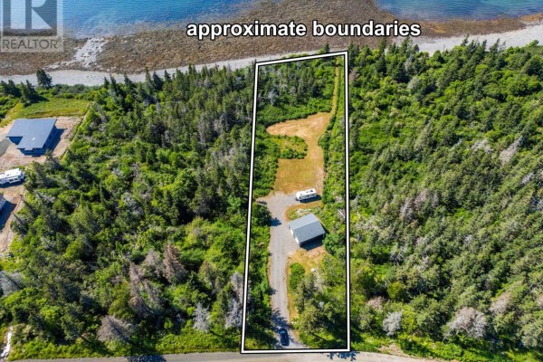 Aerial view of property lines encompassing a garage, RV, and trees. - 131 Doty Branch, Ashmore
