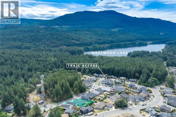 Aerial view showing the property's proximity to Westwood Lake and forest hiking trails. - 1312 Langara Dr, Nanaimo