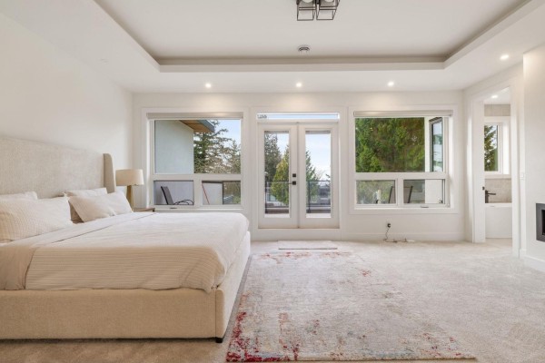 Backyard with a green lawn, wooden fence, patio, and barbecue grill. - 13125 14 Avenue, Surrey