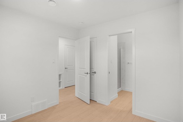 Interior view of bedroom with closet and storage space - 13131 214 St Nw, Edmonton