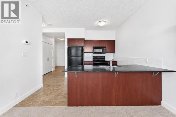 Living room/Dining room - 1314, 8880 Horton Road Sw, Calgary, AB T2V2W3 Photo 2
