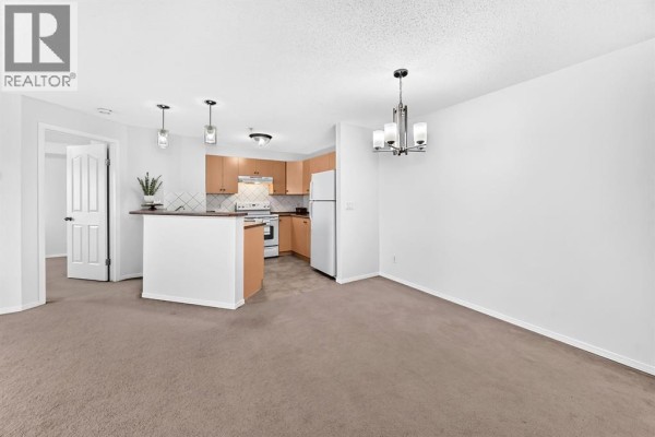 Living room - 1316, 505 Railway Street W, Cochrane, AB T4C2K9 Photo 4