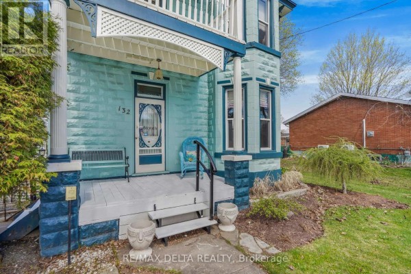 Close-up of the home's facade, featuring turret and porch - 132 High Street, Champlain