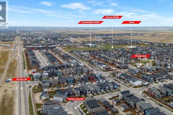 Aerial view of a Calgary neighborhood with labels for nearby amenities like soccer fields and pond. - 132 Howse Crescent Ne, Calgary