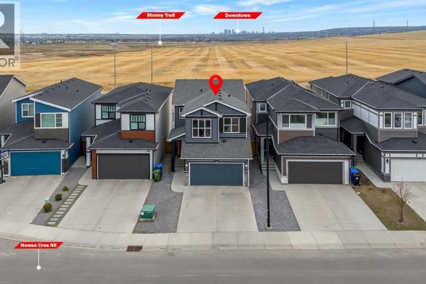 View of a street with houses and labels indicating distances to Stoney Trail and Downtown Calgary. - 132 Howse Crescent Ne, Calgary