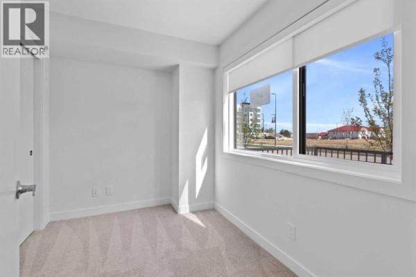 Primary Bedroom - 132 Quesnay Wood Link Sw, Calgary, AB T3E8H6 Photo 4