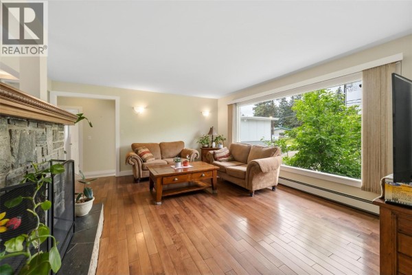 Entryway with front door, closet, and doorway into a bedroom. - 1322 Ridgedale Avenue, Penticton