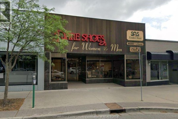 Street view of a commercial building facade with "BIDESHOES" signage. - 1329 Ottawa, Windsor
