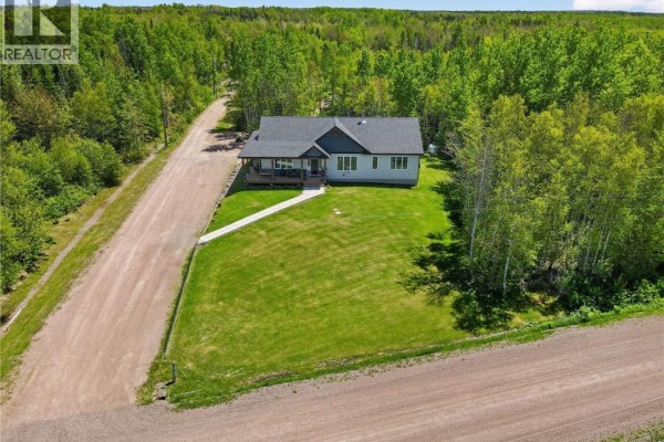 Bedroom with single bed, large window, and closet with white doors. - 133 Duguay Point Road, Johnston Point