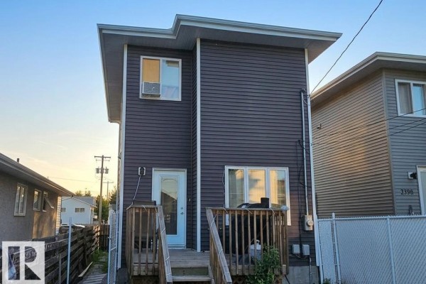 Aerial view of a dark grey house with white trim and a front entrance. - 13309 104 St Nw, Edmonton