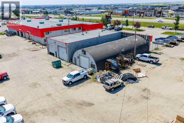 Aerial overview of the commercial property complex outlined in red, surrounded by snow. - 13313 100 Street, Grande Prairie