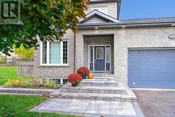 Staircase leading to upper level, with wooden railing and coat hooks - 1337 Cuthbertson Avenue, Brockville