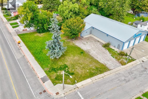 Aerial view of a large lot with a metal-clad building and a grassy area. - 134 County Rd 34 W., Cottam