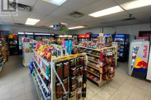 Interior view of a convenience store with aisles of snacks and drinks. - 134 Highway 60, Huntsville