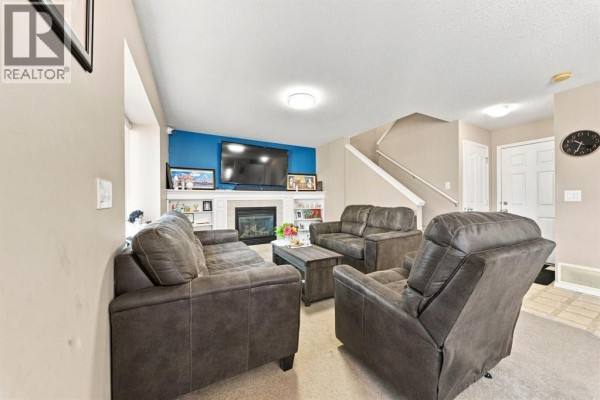 Living room - 134 Luxstone Road Sw, Airdrie, AB T4B0J7 Photo 5