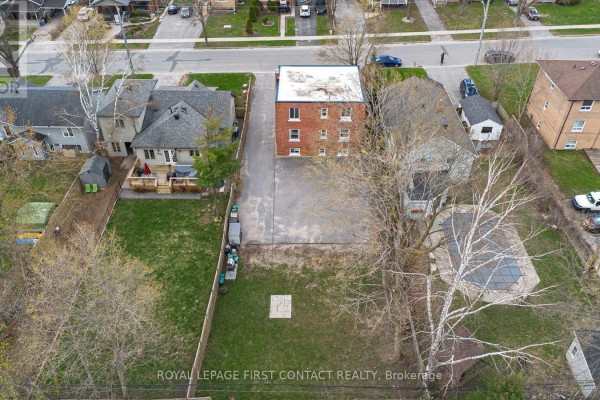 Aerial view of the triplex building, backyard, and surrounding properties. - 134 Napier Street, Barrie