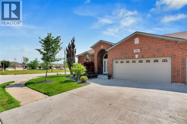 Interior foyer with tiled floor and decorative arched glass double doors. - 1340 Aspenshore, Windsor