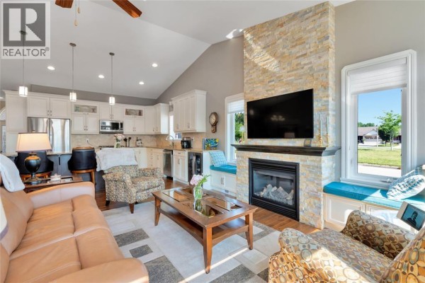 Spacious kitchen with white cabinets, stainless steel appliances, and large island. - 1340 Aspenshore, Windsor