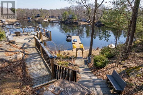 Overhead view of multi-level deck area with stairs, seating, and water access. - 1346 Is 980/deer, Georgian Bay