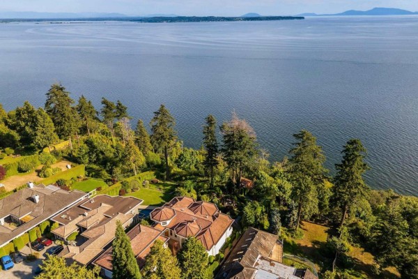 Kitchen with light wood cabinets, granite countertops, stainless steel range, and ocean view windows. - 13464 13a Avenue, Surrey