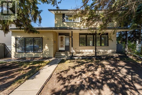 Family room - 135 Queensland Road Se, Calgary, AB T2J3R9 Photo 3