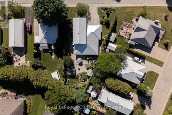 Top-down aerial view of the property and surrounding houses with driveways and yards. - 137 - 383 Mcnabb Street, Saugeen Shores