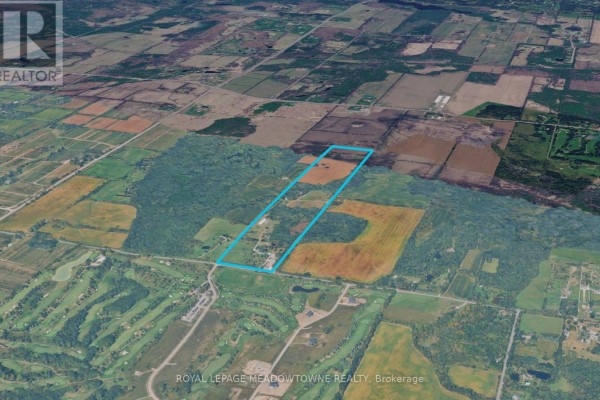 Aerial view of a rural property with fields and woodland, bordered by blue lines, adjacent to Brawley Road West and other farmland. - 1370 Brawley Road W, Whitby