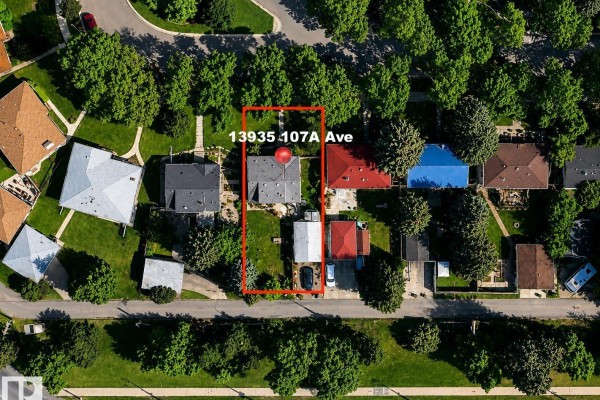Aerial view of a rectangular property at 13935 107a Av Nw, Edmonton, surrounded by mature trees. - 13935 107a Av Nw, Edmonton
