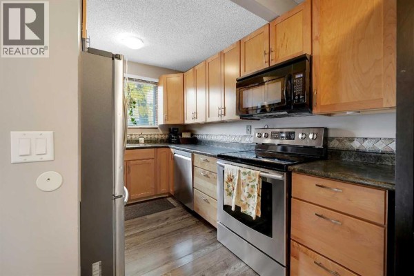Living room - 14, 7172 Coach Hill Road Sw, Calgary, AB T3H1C8 Photo 5