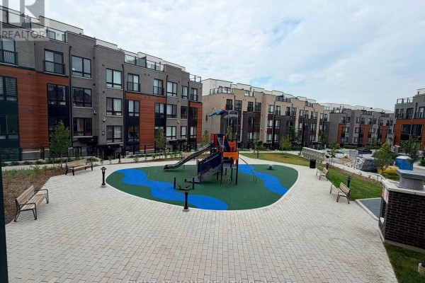 Central courtyard with a playground, seating benches, and paved walkways surrounded by townhouses. - 14 - 10 Liben Way, Toronto
