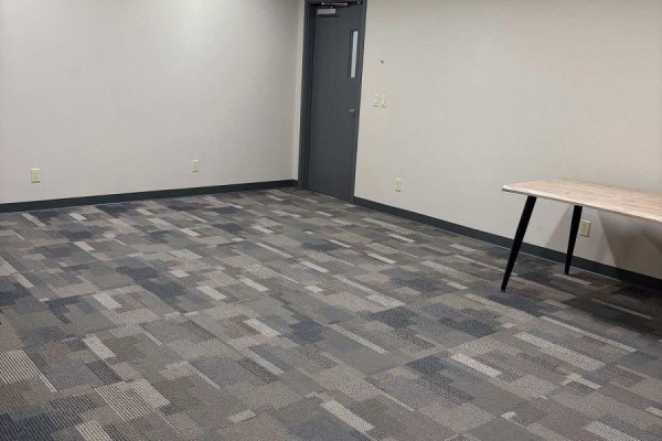 Office interior with a light wood desk and two doorways leading to other rooms. - 14 - 595 Cityview Boulevard, Vaughan