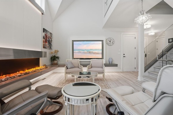 Living room with fireplace, television, and seating area. - 14 3122 160th Street, Surrey
