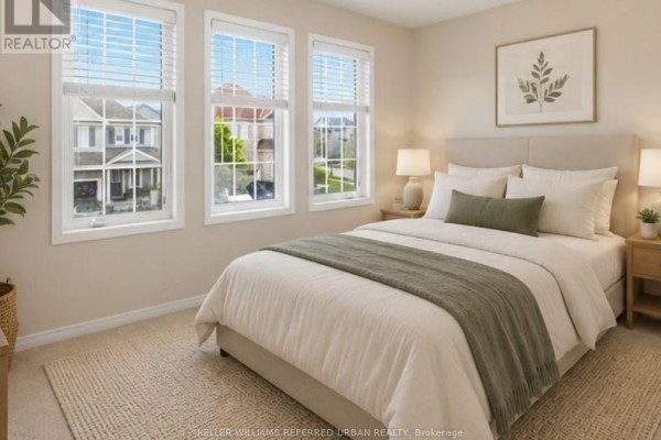Double front doors open into a bright foyer with a staircase and view of the living room. - 14 Andover Drive, Woolwich