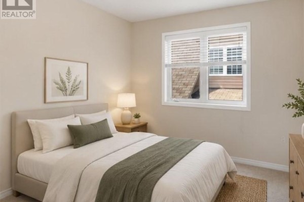 Empty bedroom with beige flooring, white walls, and two windows with blinds. - 14 Andover Drive, Woolwich