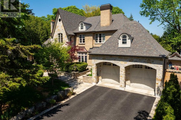 Aerial view of backyard with a swimming pool, patio, and lounge chairs. - 14 Denewood Crescent, Toronto