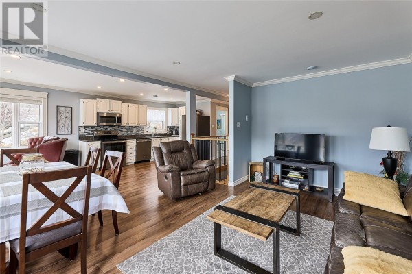 Bedroom with a double bed, window view, and open door to hallway - 14 Fort Amherst Road, St  John S