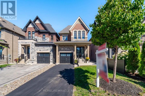 Modern brick and stone home with attached garage and double front doors - 14 Zenith Avenue Vaughan