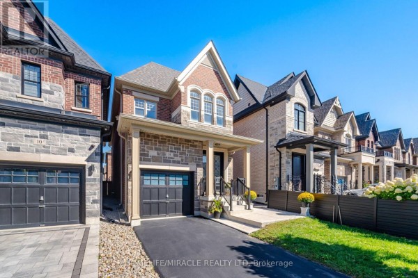 Modern suburban homes with garages, porches, and stone facades - 14 Zenith Avenue Vaughan